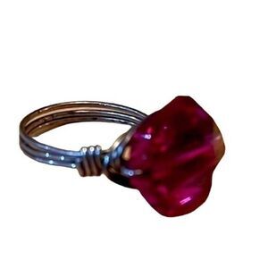 Beautiful costume jewelry ring. Silver wire hand crafted metal with pink stone